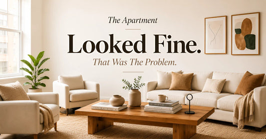 Minimalist apartment living room with neutral tones, modern furniture, and soft natural light.