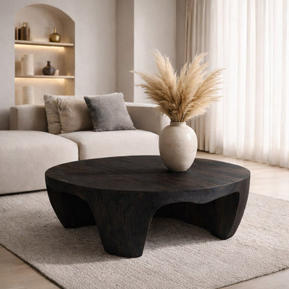 Solid Wood Round Coffee Table with Sculptural Base and Organic Carved Design