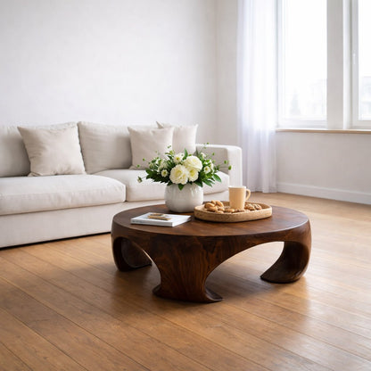 Solid Wood Round Coffee Table with Sculptural Curved Base and Organic Design